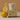 Meyer Lemon candle with packaging and lemons on a beige background
