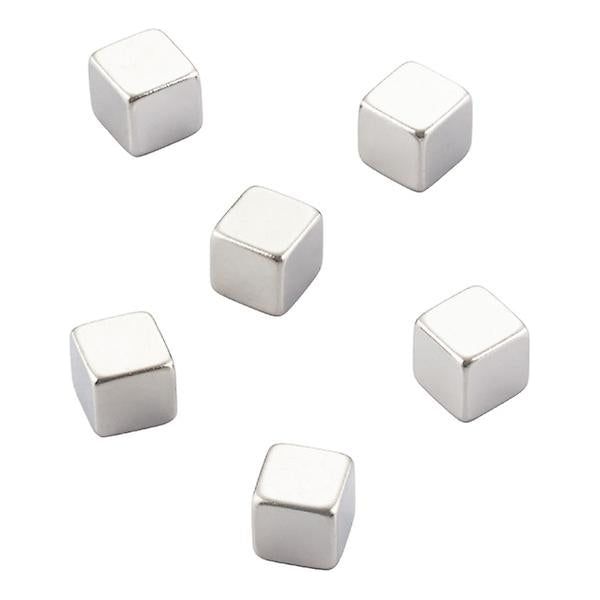 Package of six Three by Three cube magnets holding paper to a steel surface