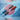 Gotta checkered mini umbrellas in their cases on a blue and pink background