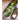 Overhead view of white fish poaching in the RSVP stainless steel poacher, topped with lime slices, sliced jalapeno, and cilantro, with the lid resting alongside on a wood surface.