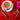 Nutcracker saucer crackers beside a cup of tea on a red tablecloth