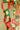 Red, green and gold patterned paper chain hanging