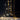 Star string lights draped over two gold-tone frames against a dark wall