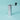 Hario Prism Ceramic Coffee Mill in silver, a slim square metal hand grinder with a black crank handle, on a teal background