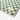 Close up of the Mate bath mat corner with the Slowtide label