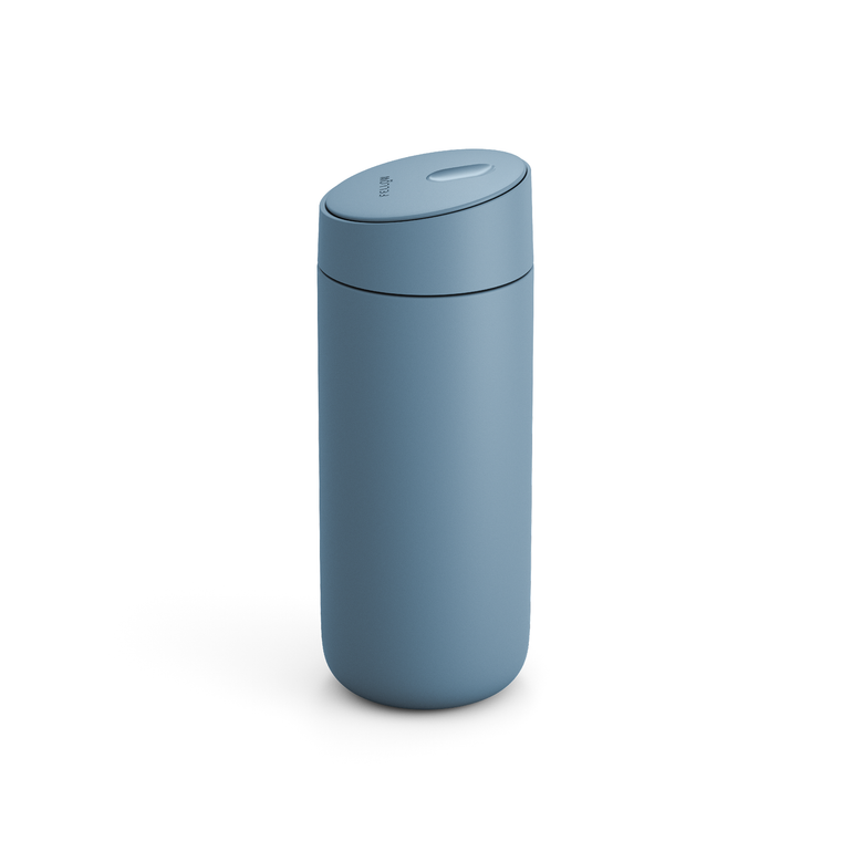 Fellow Carter Slide Mug 16 oz in Hazy Blue, matte finish with slide-open lid, on white background.