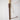 Fodory Wood Baking Brush in Walnut, a dark wood handle with pale bristles and a leather hanging loop, against a marble wall