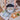 Hands setting the Holiday in the Park round tray on a table with a matching tea towel, drinks, cheese and olives