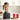 Black Vitamix VX1 blender filled with fruit on a kitchen counter beside two juice glasses