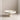 White Party Cake Stand on a beige surface