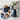 Navy blue Smeg toaster and kettle on a marble counter with waffles, tea and blueberries