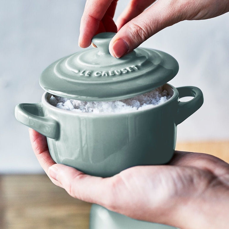 Le Creuset mini cocotte souffle dish with vibrant enamel finish and round shape, perfect for individual servings.