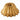 Nordic Ware Lotus Bundt pan in gold with petal-shaped fluted design