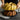 Lifting the gold Braided Bundt pan off a baked cake