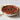 Le Creuset Heritage fluted stoneware pie dish with a scalloped edge.