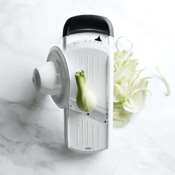 OXO Simple Mandoline with adjustable blade for precise slicing and julienning of vegetables on a white background.