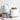 White Smeg toaster and kettle on a kitchen counter with bread, jam and tile backsplash