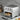 Compact air fryer toaster oven on a counter with the door open and the fry basket pulled out