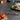 RSVP straining tongs beside a grill pan of raw vegetables