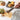 RSVP straining tongs holding fried chicken over a cutting board