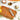 RSVP marinade injector on a cutting board with oil, herbs and spices