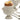 Close-up of a cracked soft-boiled egg in a white porcelain hen egg cup, spoons beside it