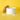 Salt XL cellar of flaky salt on a yellow background with the lid propped behind