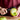 Hands peeling a green apple with the OXO swivel peeler