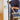 Person sweeping a floor with the CleanTech wall-mounted broom