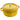 Staub round cocotte open on the table with food inside