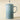Le Creuset French Press in vibrant color with glass carafe and stainless steel handle for brewing coffee or tea.