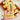 Hand squeezing a butter-stick squishy toy