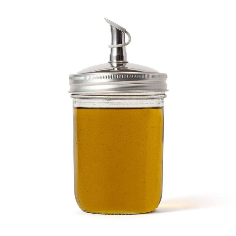 Jarware oil cruet lid with a no-drip spout on a mason jar