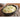 Bowl of mashed potatoes topped with chives