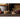 Two Now Designs veggie brushes on a wooden shelf beside beets and radishes