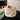 Fabric bread basket with bread on a stovetop in a kitchen setting
