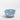 Egg Back Home Cloud Cereal Bowl in satin blue with white clouds, on a white background