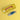 Balvi blue sardine shaped corkscrew standing beside its yellow tin case