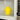 Yellow lemon-shaped microwave cleaner steaming on a microwave turntable