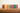 East End Press gift tag packages lined up on a wooden shelf