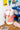 Laundry bag in a bedroom next to blue shelving