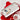Candy cane platter holding a snowman cookie on a red holiday table