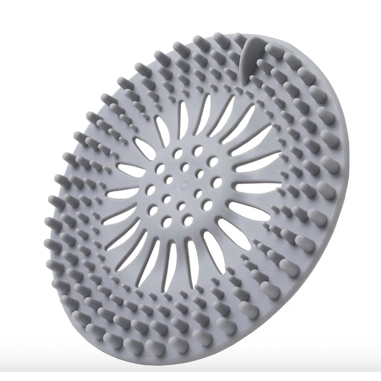 BROXAN thermoplastic rubber hair catcher sitting flat over a drain
