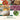 Grid of foods prepped in the Cuisinart Custom 14: chopped salsa, mixed cookies, shredded cheese, sliced onions, kneaded dough and puréed pesto