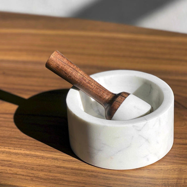 Pestle resting in the marble mortar