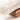 Close-up of the rounded end of the marble rolling pin on its base