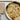 Plate of homemade garganelli next to the board