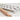 Close-up of the Verve Culture 12 cavity aluminum ravioli mold with beechwood rolling pin