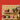 Colorful mugs and a lunch bag on a wooden pegboard against a red background