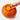 Scooping seeds out of a pumpkin with the orange Chef'n pumpkin scoop